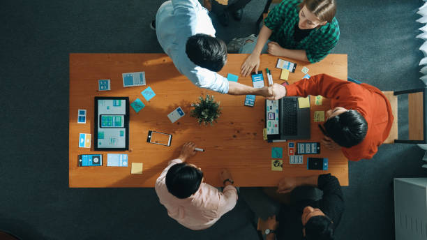 istock Top view of developer and designer shake hand together at meeting. Convocation. 2166883147