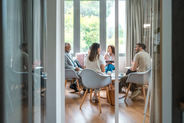 Diverse Team Engages in Productive Meeting Indoors