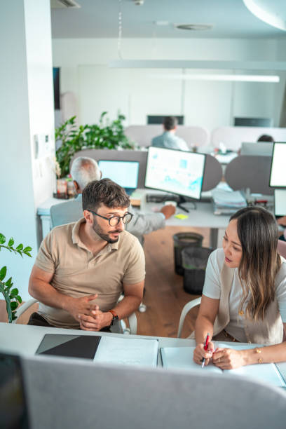istock Diverse Team Engages in Project Planning at Modern Office 2166883730