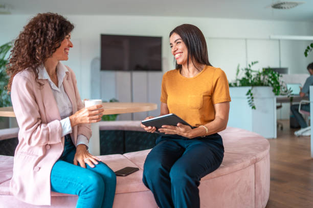 istock Joyful Diverse Female Colleagues Collaborating in Modern Office 2166883758