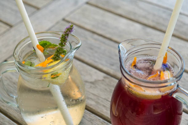 istock Refreshing drink with ice. Homemade lemonade with lemon, mint on a grey back 2166883862