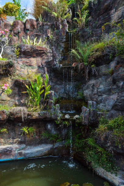 Serene Multi-Tiered Waterfall: Tranquil Oasis in a Garden Pond