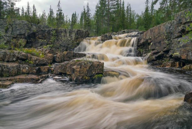 istock The Lusbostupet waterfall in the Aman river 2166885644