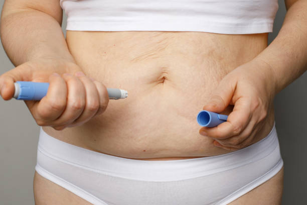 istock Woman injecting insulin with insulin pen 2166885671