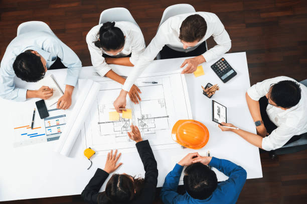 istock Diverse group of civil engineer and client working on architect. Prudent 2166886977