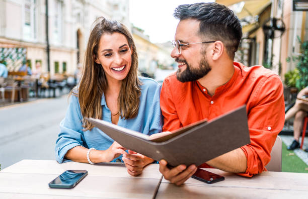 istock Couple reading the menu in the restaurant 2166887358
