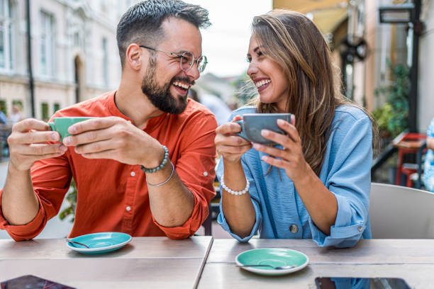 istock Young couple in love drinking coffee together 2166887427