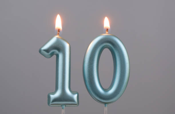 istock Blue birthday candles on gray background, number 10 2166889277