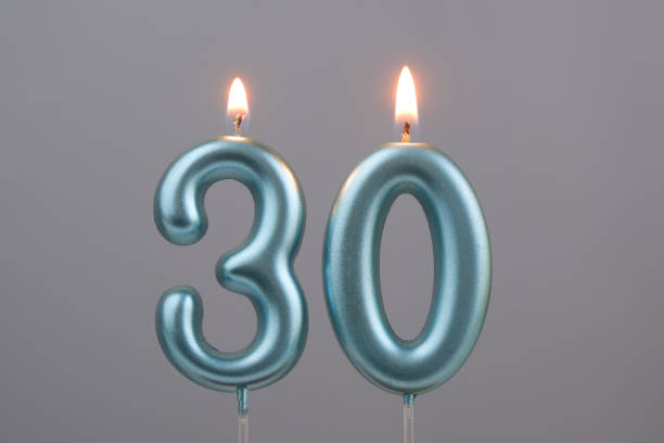 istock Blue birthday candles on gray background, number 10 2166889281