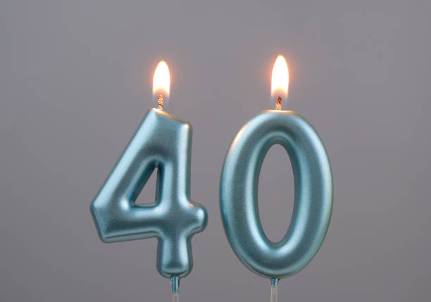 istock Blue birthday candles on gray background, number 40 2166889285