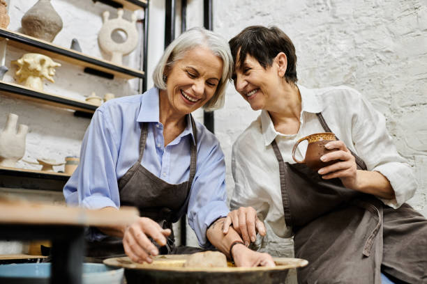 istock Cheerful couple crafting earthenware together at a pottery workshop in their creative space 2166889397