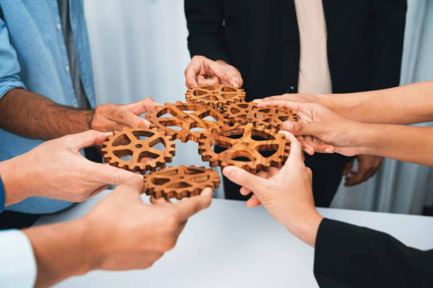 istock Business team joining cogwheel in circular together. Prudent 2166890937