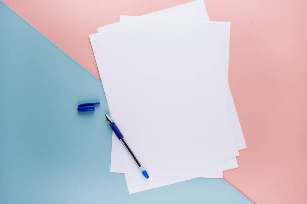 Blue Pen and White A4 Paper on Pink and Textured Blue Background