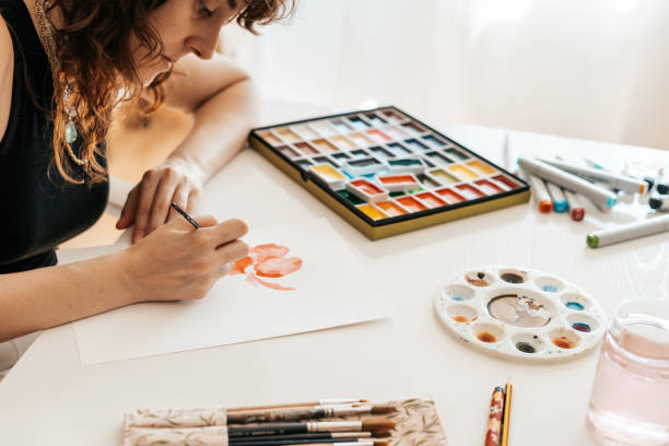 istock woman drawing with watercolors 2166891312