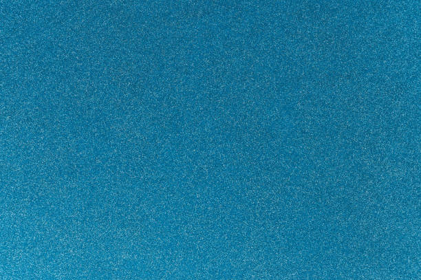 istock Turquoise colored glitter cardstock paper background 2166891335