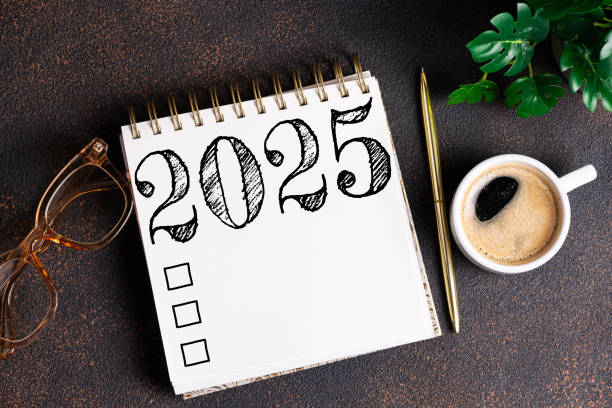 istock New year resolutions 2025 on desk. 2025 goals list with notebook, coffee cup, plant on table. Resolutions, plan, goals, action, checklist, idea concept. New Year 2025 resolutions 2166891464