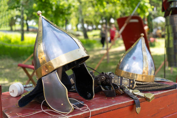 istock Ancient Roman legion archer helmets on a chest 2166892126