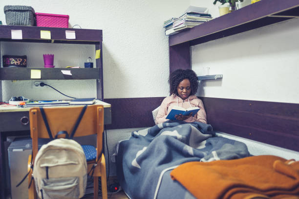istock Cozy Evening Reading in Dorm Room 2166892435