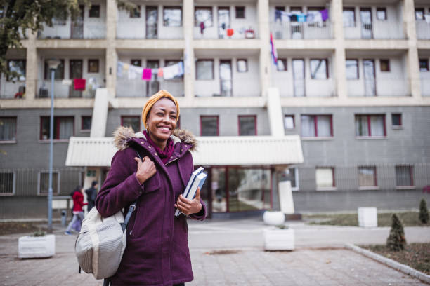 istock College Student in Front of Dormitory Building 2166892473