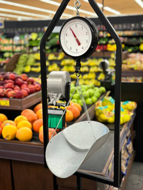 Grocery scale in a supermarket Weight scale in front of groceries in supermarket vintage kitchen scale with fruit stock pictures, royalty-free photos & images