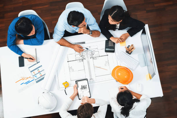 istock Diverse group of civil engineer and client working on architect. Prudent 2166893774