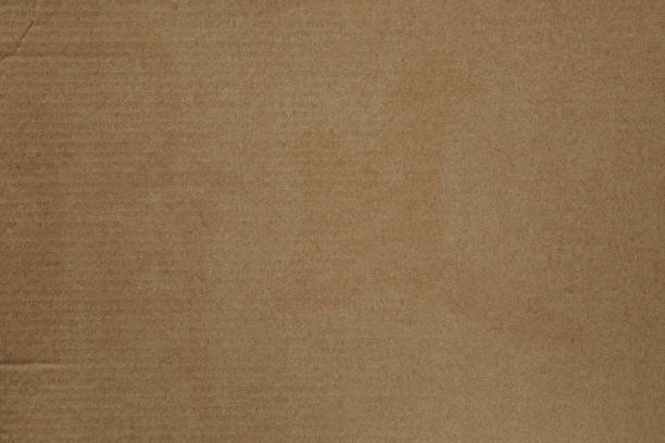 Cardboard sheet texture background, detail of recycle brown paper box pattern.