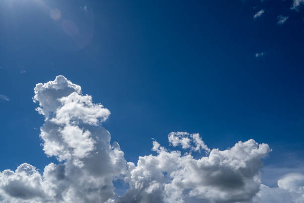 istock clouds and blue sunny sky,  white clouds over blue sky, Aerial view,  nature blue sky white cleat weather. 2166898264