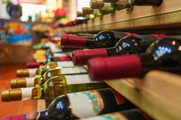 istock A Well-Organized Wine Rack Displaying Various Bottles in a Cozy Wine Shop Setting 2166898333