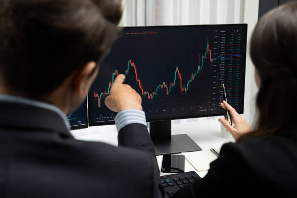 istock Business traders discussing on dynamic stock risk or profit point. Postulate. 2166898683