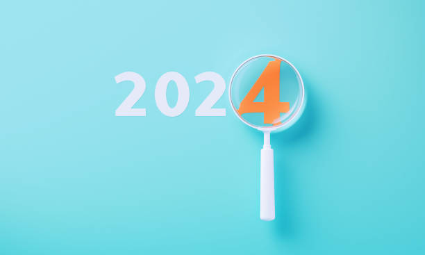 istock Colorful Magnifiers Over Orange 2024 On Blue Background 2166899079