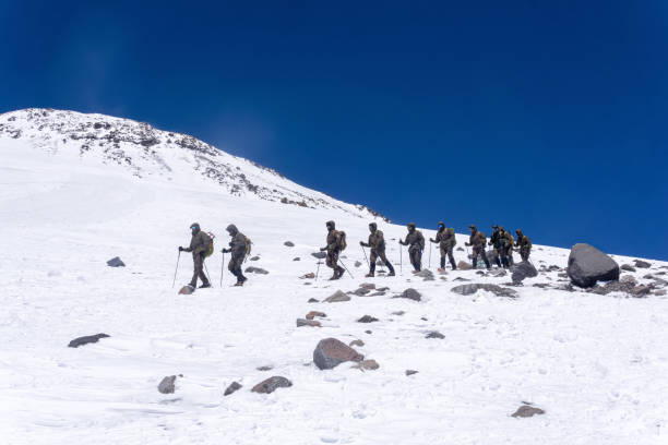 Elbrus, Russia - August 02, 2024: mountain troops undergo training in highlands terrain