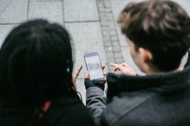 istock Connecting Over a Smartphone on a Sidewalk 2166899790