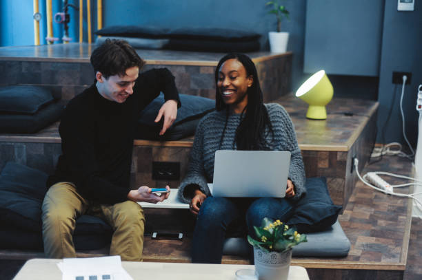 istock Young Professionals Collaborating in Modern Office Lounge 2166899809