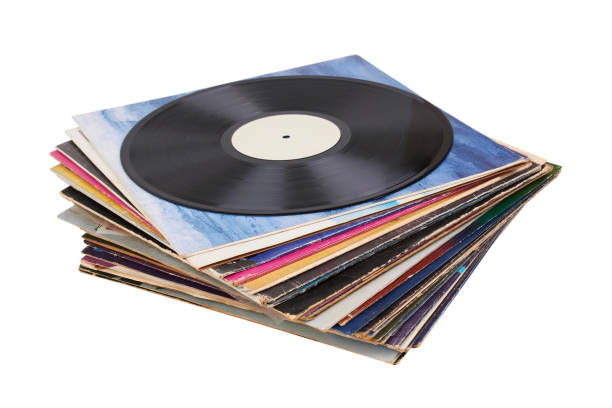 istock Vinyl record on a stack paper envelopes. Analog sound. Classic audio. Isolated on white 2166899989