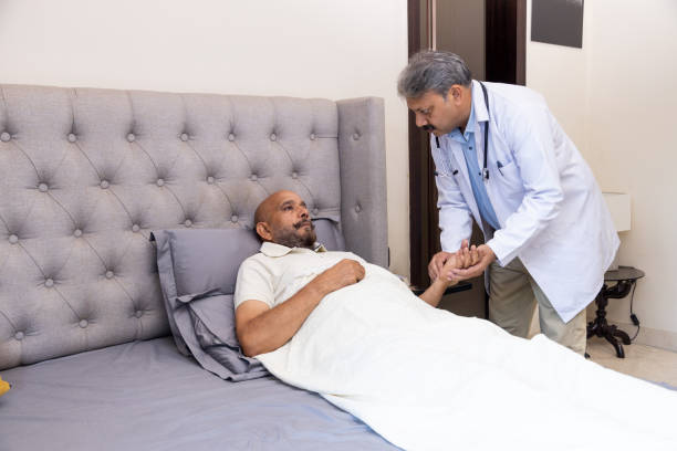 istock Doctor Conducting Home Check-Up with Elderly Patient 2166900108