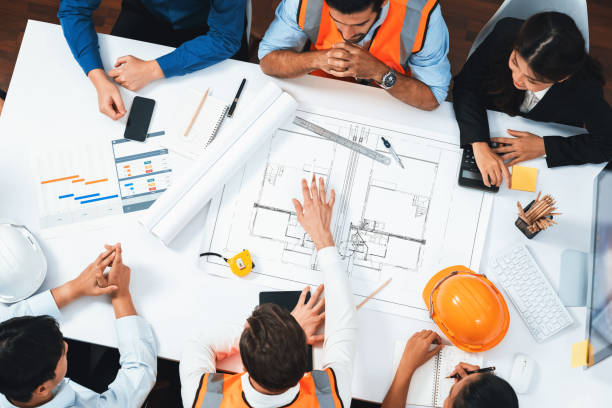 istock Diverse group of civil engineer and client working on architect. Prudent 2166900571