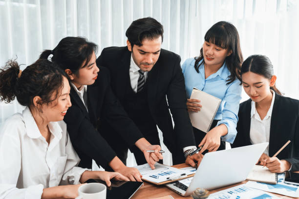 istock Group of business analyst team analyzing financial data report. Habiliment 2166900692