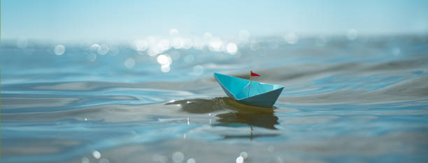 istock Blue paper boat panorama 2166901067