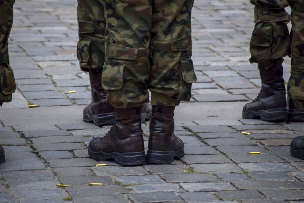 Special forces soldier wearing camouflage uniform armed with weapons in conflict war zone