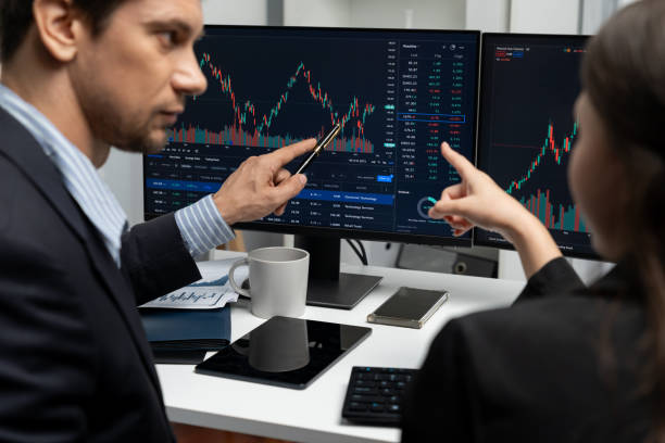 istock Business traders discussing on dynamic stock risk or profit point. Postulate. 2166904834
