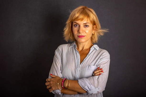 istock Confident woman looking at camera with serene expression in casual clothes 2166911045
