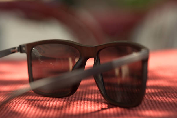 istock A pair of sunglasses is sitting on a red table 2166911263