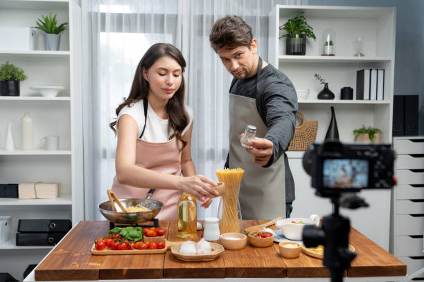 istock Influencers on cooking show presenting ingredient of spaghetti dish. Postulate. 2166912607