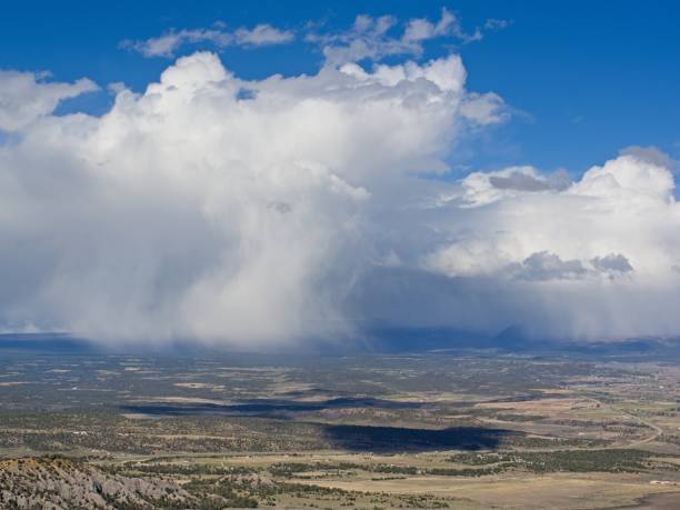 istock Rain shower develops below the peaks of Mesa Verde 2166912810