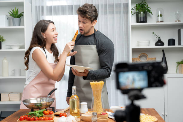 istock Chef influencers cooking special spaghetti with tongs to fried pan. Postulate. 2166912845