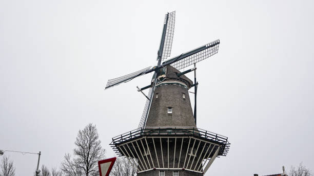 Windmill located at De Gooyer in Amsterdam, windmill in Amsterdam, famous windmill in Amsterdam, Traditional WindmillDe Gooyer is a windmill in Amsterdam located between Funenkade and Zeeburgerstraat. It is the tallest wooden mill in the Netherlands at 26.6 meters high. It is registered as a National Monument.The names dates from the around 1609, when the mill was owned by Claes and Jan Willemsz, two brothers from Gooiland. It is also known as \