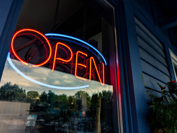 istock open sign on a glass door 2166923476