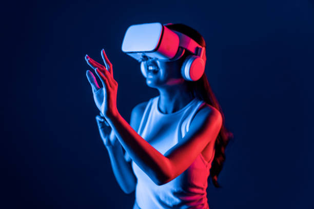 istock Elegant female connect metaverse use finger point virtual object. Hallucination. 2166925152