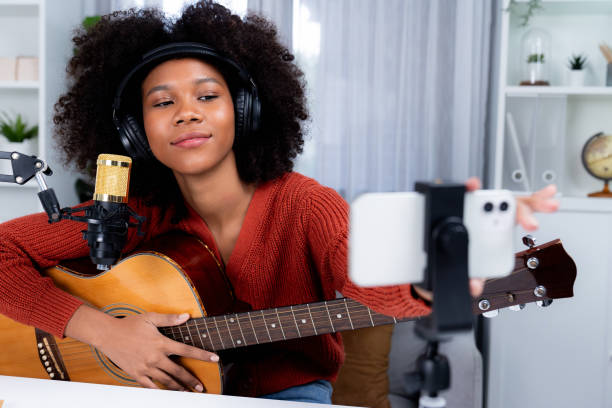 istock Host channel of African setting smartphone in broadcast studio. Tastemaker. 2166925287