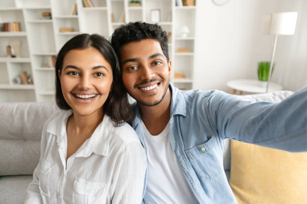 istock Happy indian couple taking selfie with cheerful expression 2166926115
